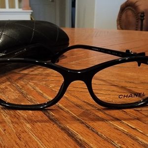 CHANEL black glitter frames with CHANEL bow tie.